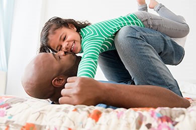 Man playing with his daughter